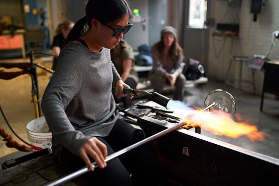 guided campus tour group watching glass blowing